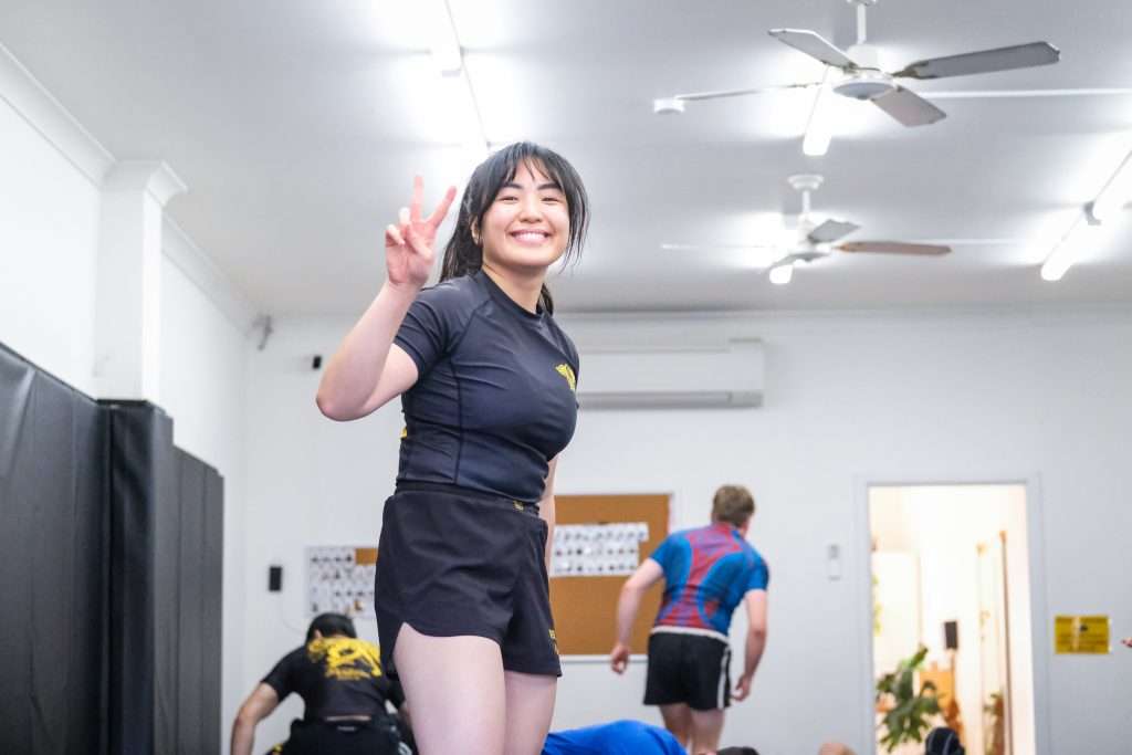 DSCF8227 | Partizan Grappling Woman smiling at jiu jitsu gym in Kingsford