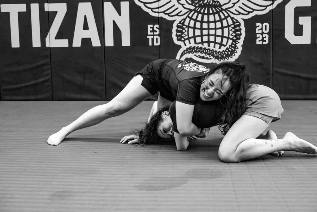 Friendly women training BJJ.